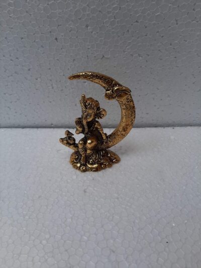 Auspicious Golden Metal Ganesha on Crescent Moon Statue - Decorative Lord Ganesha Sitting on Moon Figurine for Car Dashboard, Pooja Mandir & Festive Return Gifting By The Giftory